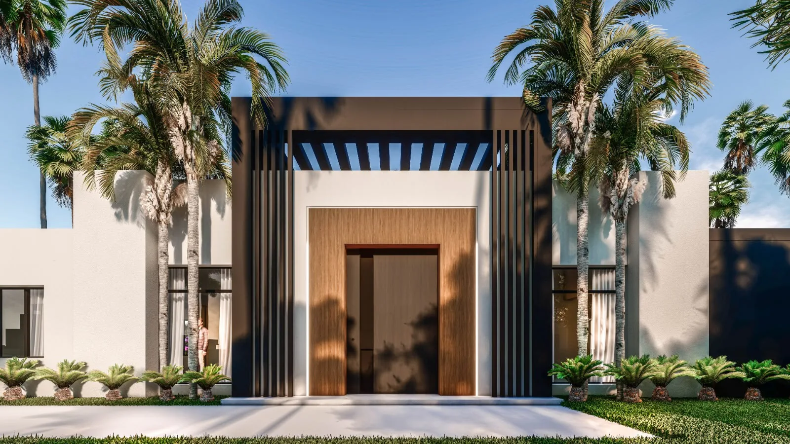 Wooden front door framed by dark slats, between two palm trees